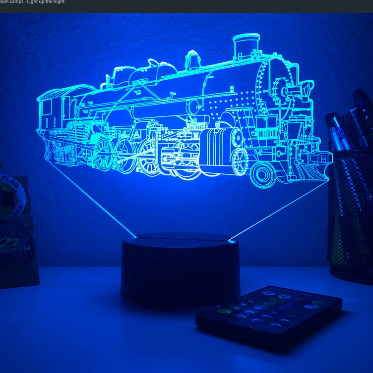 A light up train display on a desk.